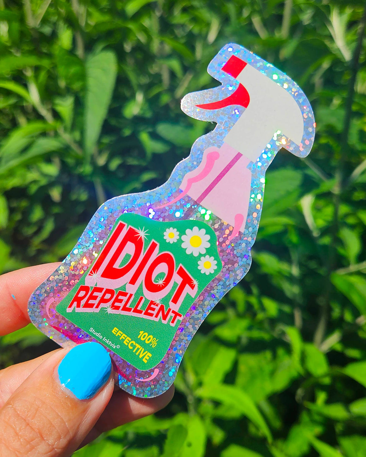 Sticker Pailleté — Spray Répulsif à Idiots · Studio Inktvis